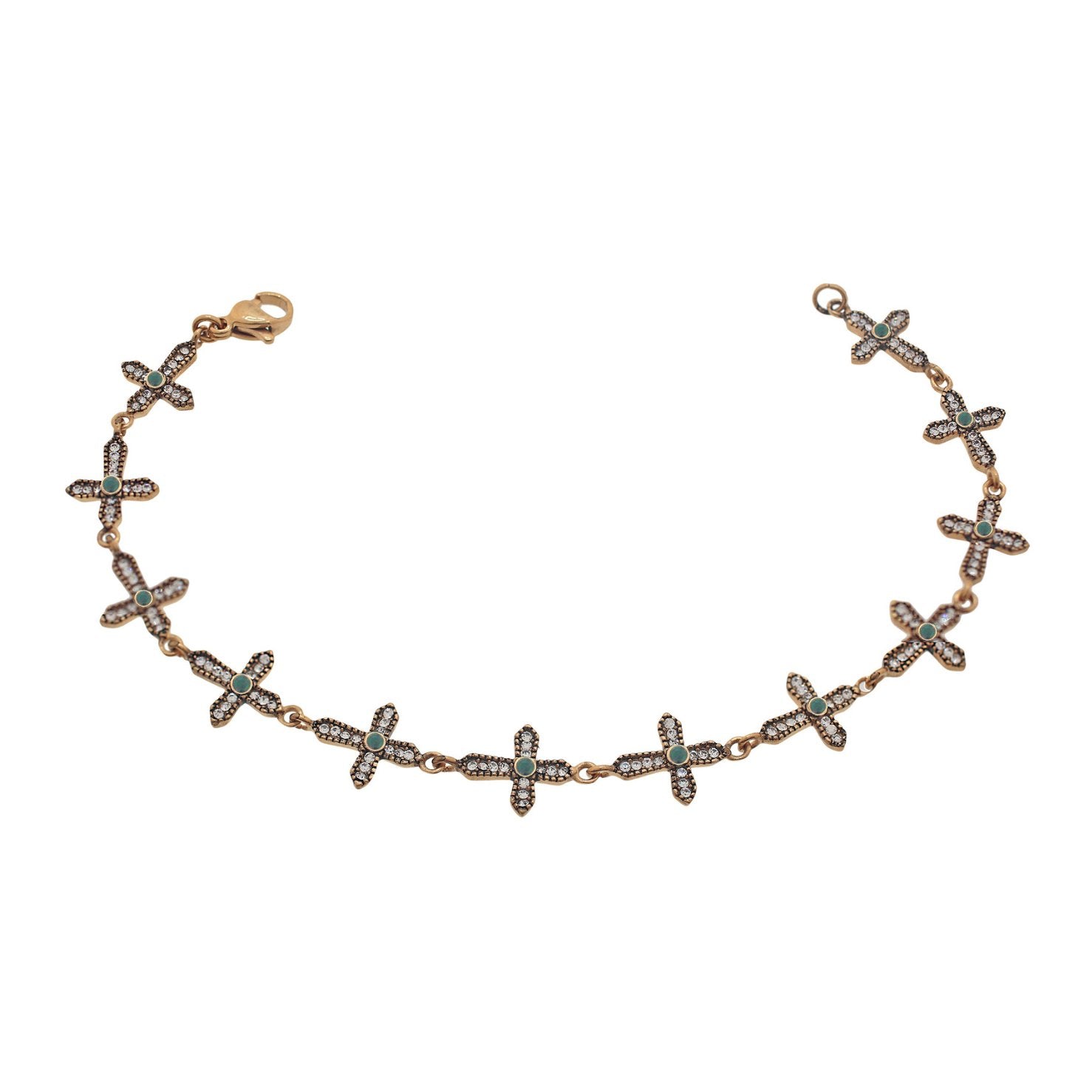 Gold bracelet featuring cross-shaped links, Each cross is adorned with alternating white zircon and green, emerald crystals